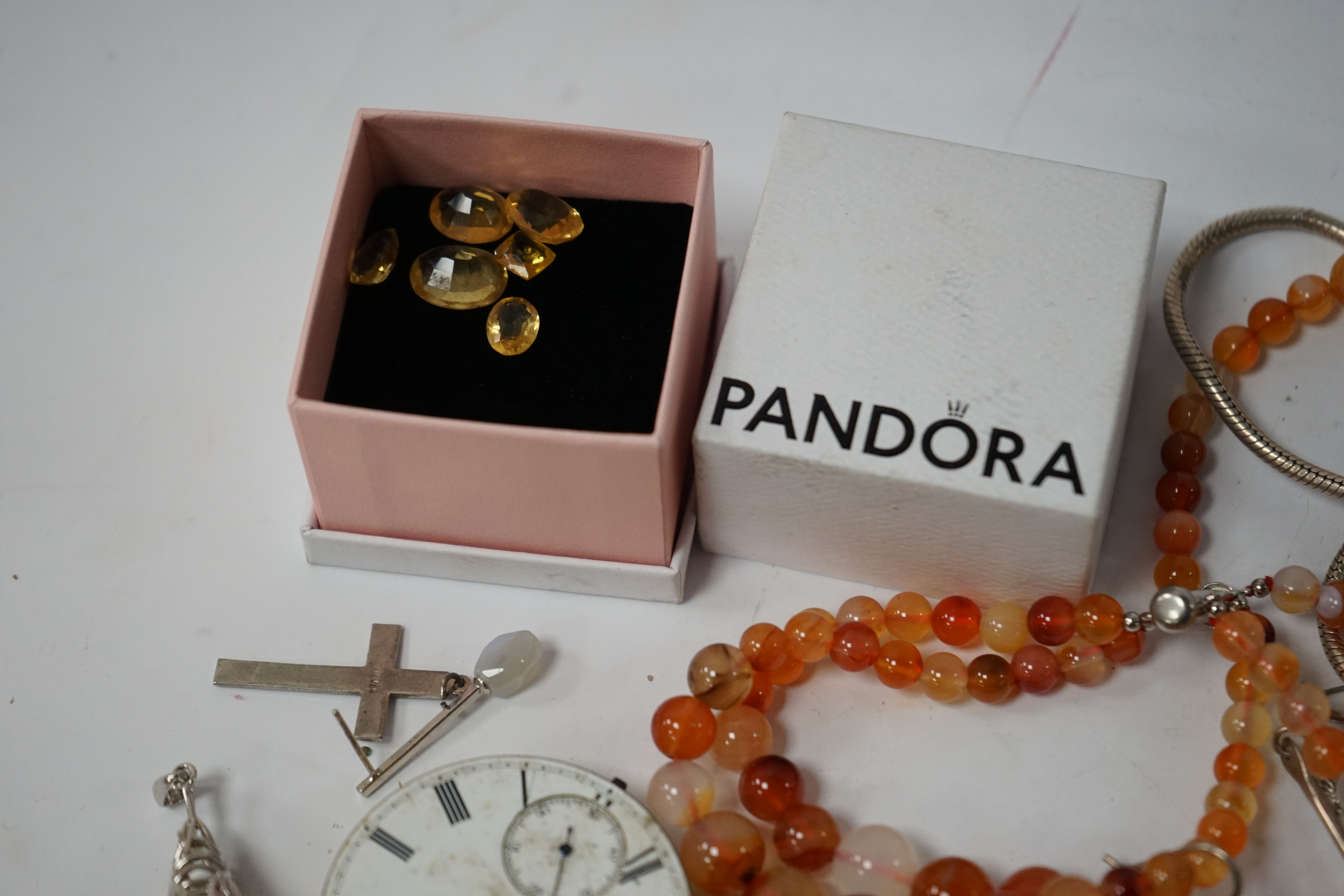 A small quantity of assorted jewellery and other items including a filigree butterfly brooch, a 925 and labradorite ring, an agate bead necklace, pocket watch movements, etc. Condition - poor to fair